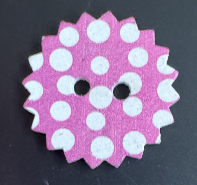 Botón puntas rosa con lunares blancos