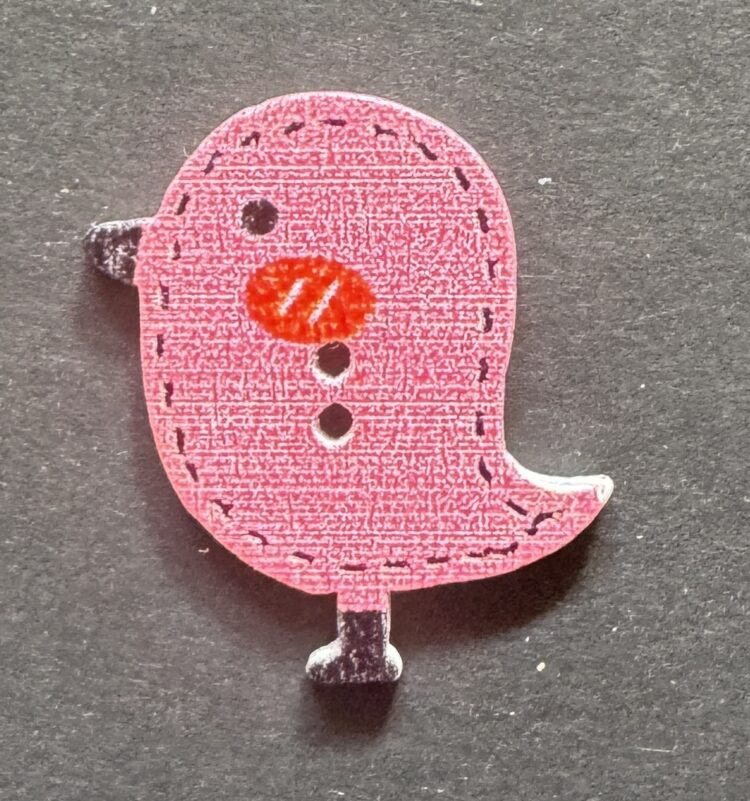 Botón pollito rosa con punteado