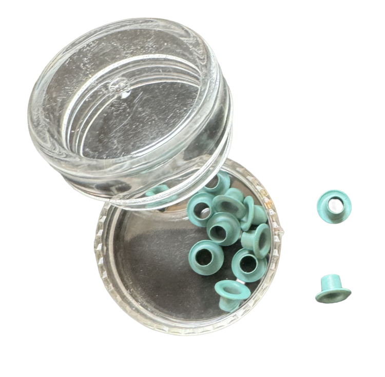Bote ojales turquesa scrapbooking